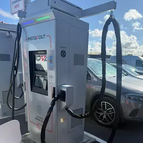 A close-up view of an InstaVolt charger in action, highlighting cable management, clear instructions, and accessibility at the McDonald's Middlesbrough EV charging location.