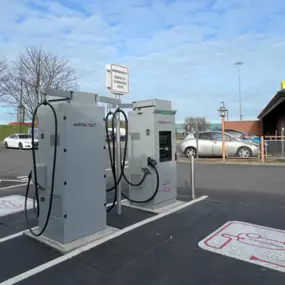 Two InstaVolt ultra-rapid chargers are positioned in a dedicated EV charging bay beside a McDonald’s restaurant in Middlesbrough, offering convenient access for drivers.