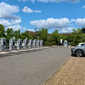 Power up your electric vehicle at InstaVolt’s expansive rapid charging hub in Syon Park, London, located just off the M4. This charging station features 14 state-of-the-art chargers powered entirely by renewable energy, providing eco-friendly, rapid charging solutions. InstaVolt offers a seamless charging experience with contactless payments and no required memberships, surrounded by the convenience of local shops, dining, and the historic Syon House estate.