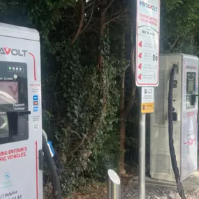 A row of InstaVolt ultra-rapid chargers located at Keypoint on the A34 Northbound near Stone. The charging units are neatly aligned with dedicated EV bays and surrounded by greenery, providing a convenient and accessible stop for electric vehicle drivers.