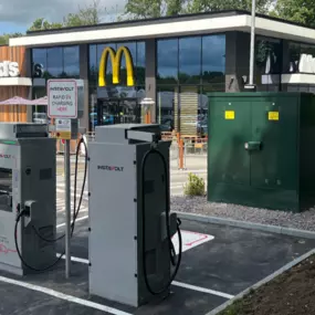 This image shows two InstaVolt EV chargers installed in the car park of McDonald’s on Foxhole Road in Chorley. The chargers are positioned at the front of the restaurant, with clearly marked EV bays.