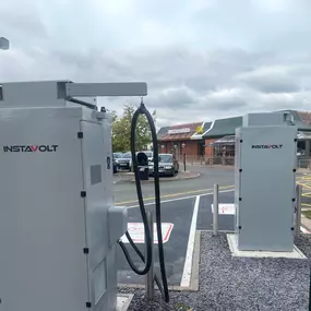 Two InstaVolt ultra-rapid chargers located in Brierley Hill, positioned next to a McDonald’s restaurant, offering convenient access for EV drivers while dining.