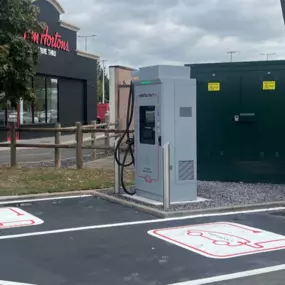 Ultra-rapid InstaVolt chargers situated by Tim Hortons in Brierley Hill, allowing EV users to recharge while visiting nearby food outlets.