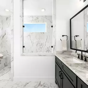 Spa-inspired primary bathroom with dual vanities and oversized shower