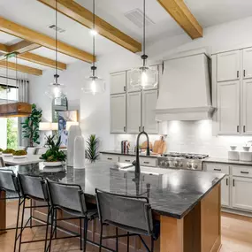 Chef-inspired kitchen with expansive island and casual dining area