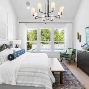 Spacious primary bedroom retreat with vaulted ceiling