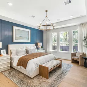Spacious primary bedrooms with tranquil backyard views