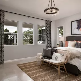 Beautiful primary bedroom suites with a sitting area and ample natural light