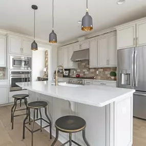 Well-equipped kitchens with ample countertop and cabinet space and center islands
