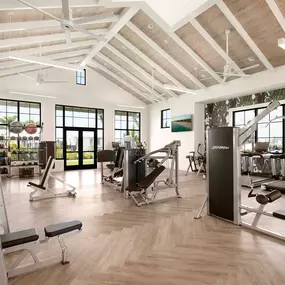 State-of-the-Art Fitness Center with free weights, machines, and yoga lawn