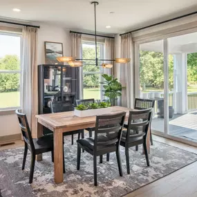 A casual dining area overlooks the luxury outdoor living space