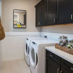 Laundry room with spacious cabinet storage