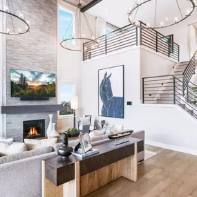 Two-story great room with plenty of windows draws light throughout the home