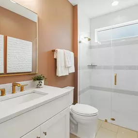 Generous secondary bathrooms with dual vanities