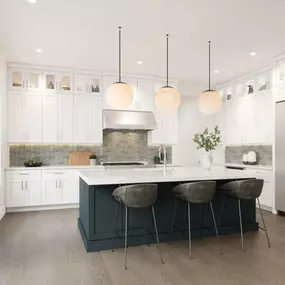 Gourmet kitchen boasts a large center island and plenty of storage