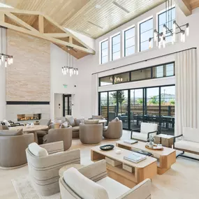 The great room with expansive doors opening to a covered patio