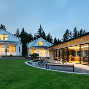 The modern community clubhouse and contrasts with the cottages in a striking white palette