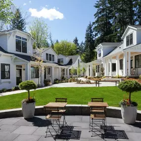 White cottage-style homes overlooking the Center Green and clubhouse terrace