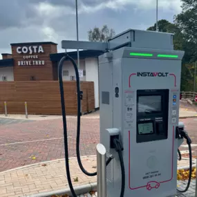 An InstaVolt ultra-rapid EV charger stands ready for use outside Costa Coffee Drive Thru in Bromsgrove. Ideal for quick charging while grabbing a coffee, this charger is clearly marked with instructions and contact support details.