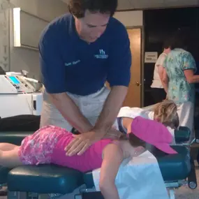 Dr. Dahmer adjusting a pediatric patient