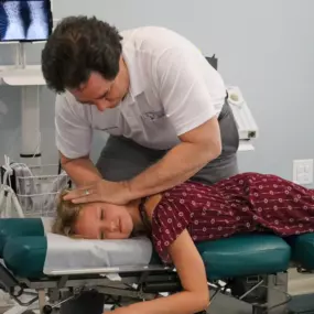 Dr. Dahmer adjusting a pediatric patient