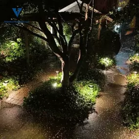 Garden and walkway illuminated with outdoor landscape lighting installed by Wehrle Electric LLC, licensed electricians serving Covington KY and nearby cities.