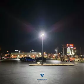 Bright parking lot light installation completed at night by Wehrle Electric LLC, licensed electricians serving Covington KY and the surrounding 40-mile area.