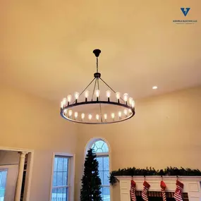 Large chandelier light fixture installed in a living room by Wehrle Electric LLC, licensed residential electricians serving Covington KY and surrounding cities.