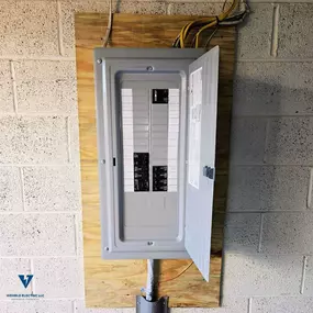 New breaker panel with open cover installed by Wehrle Electric LLC, licensed electricians serving Covington KY and a 40-mile surrounding service area.
