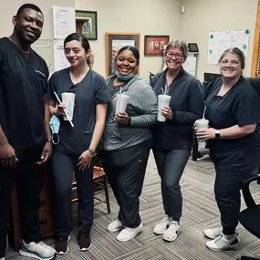 The Dental Depot dental team poses for a photo at in the office of the dental clinic in Tulsa