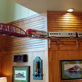 A model train runs along the top of the lobby at Dental Depot's dentist office.