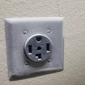 Replace the faulty dryer receptacle and repair burnt wires