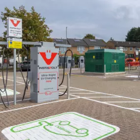 Spacious InstaVolt ultra-rapid EV charging location set near residential housing, providing easy access for local and passing drivers.