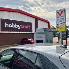 An InstaVolt ultra-rapid EV charging unit is located directly in front of the Hobbycraft store, offering convenient charging for shoppers at Tower Retail Park.