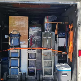Items neatly packed and organized inside the Donation Movers truck, ready for delivery.