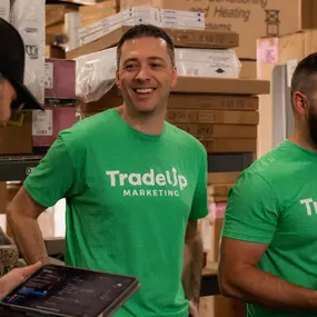 TradeUp Marketing owners working with a client on video production