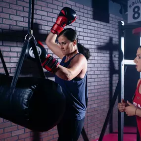 Adult woman being trained by instructor