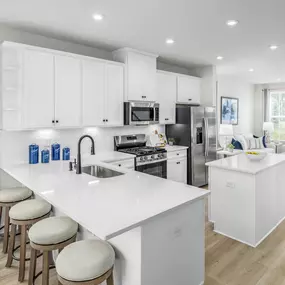 Built for lasting memories with quartz counters, gas cooking, and stainless-steel appliances.