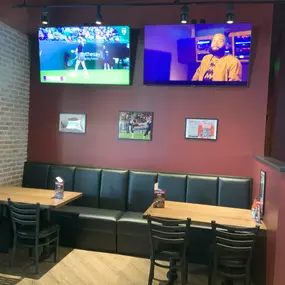 Long booth with seating inside Anchor Bar Leesburg