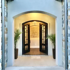 These beautifully appointed custom 8' double iron doors were chosen by Christian Builders Custom homes and roofing for one of their parade homes.