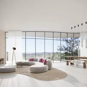 Modern living room with glass walls, neutral tones, and panoramic countryside view.