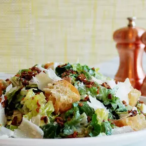 romaine, arugula, parmesan, bacon , croutons, caesar dressing