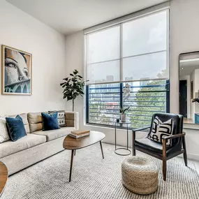 Designer Furnished Living Room with Large Windows at Sentral Wynwood
