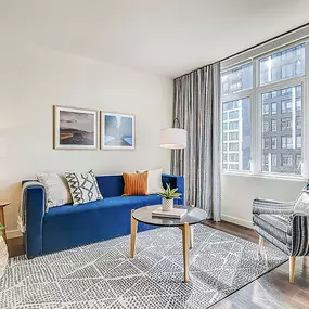 City Views from Your Designer Furnished Living Room at Sentral Union Station