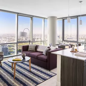 Spacious Living Room and Large Kitchen Island with Floor to Ceiling Windows at Sentral Michigan Ave