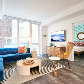 Living room and bedroom at Sentral DTLA at 732 S. Spring
