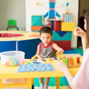 A joyful moment between a child and therapist, representing the personalized care provided through Applied Behavior Analysis (ABA) services. This image showcases how ABA at Bierman is play-based, child-led, and outcome-driven—designed to spark progress and possibilities® in every child.