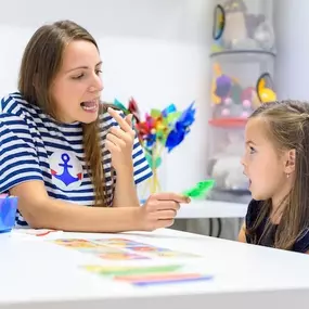 Communication unlocked through connection! This image showcases a speech therapy session where a child is learning to express themselves with the help of a skilled speech-language pathologist. Bierman’s approach celebrates every new word, sound, or gesture as a milestone.
