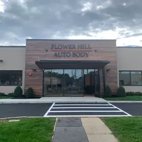 Flower Hill Auto Body of Huntington Station, NY, a state-of-the-art collision repair facility proudly serving Long Island’s North Shore. The shop’s modern exterior reflects its dedication to precision craftsmanship, OEM-certified repairs, and exceptional customer service. As part of the Flower Hill Auto Body family, this location specializes in aluminum and structural repairs, computerized color matching, and advanced driver assistance system (ADAS) calibration.