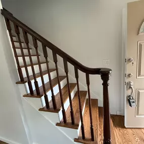 Beautiful staircase refinishing project featuring updated hardwood, a dark-stained handrail, and clean interior updates. Selective Remodeling specializes in interior renovations and home upgrades across Long Island.